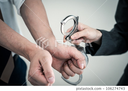 Man handcuffed for arrest 106274743