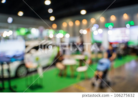 Blurred images of trade fairs in the big hall. image of people walking on a trade fair exhibition or expo where business people show innovation activity and present products in a big hall. Blurred images of trade fairs in the big hall. image of people walking on a trade fair exhibition or expo where business people show innovation activity and present products in a big hall. 106275632