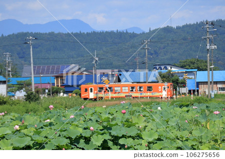 A diesel train passing through the Ogata railroad crossing A diesel train passing through the Ogata railroad crossing 106275656
