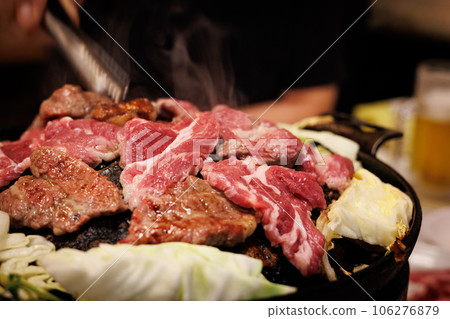 Bake raw lamb in a Genghis Khan pot 106276879