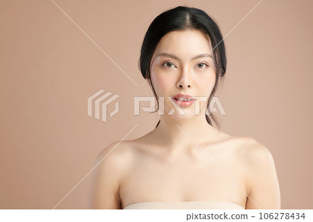 Beautiful young asian woman with clean fresh skin on beige background, Face care, Facial treatment, Cosmetology, beauty and spa, Asian women portrait. 106278434