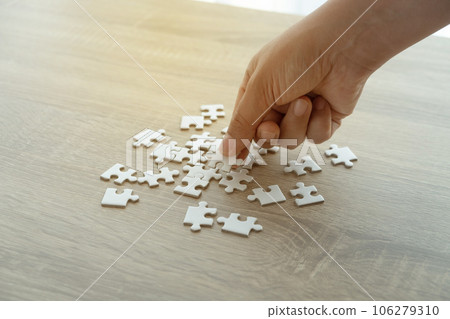 puzzle pieces on the wood table puzzle pieces on the wood table 106279310