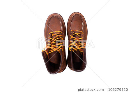 Brown boot on white background. Brown boot on white background. 106279320