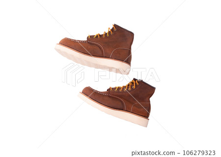 Brown boot on white background. Brown boot on white background. 106279323