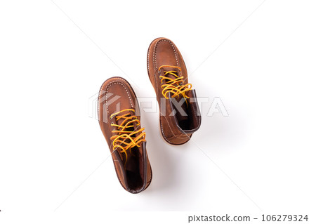 Brown boot on white background. Brown boot on white background. 106279324
