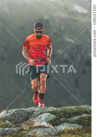 A man trains by running in the mountains A man trains by running in the mountains 106281305