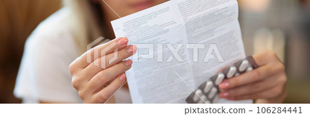 Woman reads medical instruction at home. Woman reads medical instruction at home. 106284441