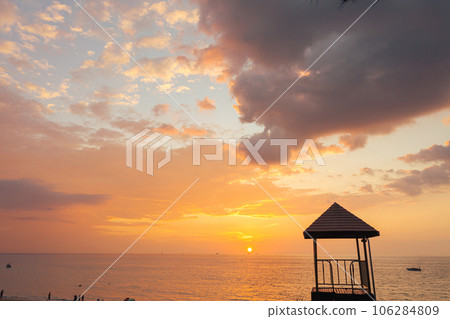 sunset at Karon beach.Karon beach is a beach is broad and long. Sand and beautiful beach suitable for swimming and used as a training dive..Karon beach have many kind of water sports 106284809