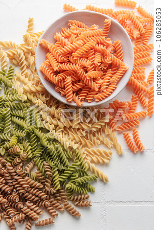 A variety of fusilli pasta from different types of legumes. Gluten-free pasta. A variety of fusilli pasta from different types of legumes. Gluten-free pasta. 106285053