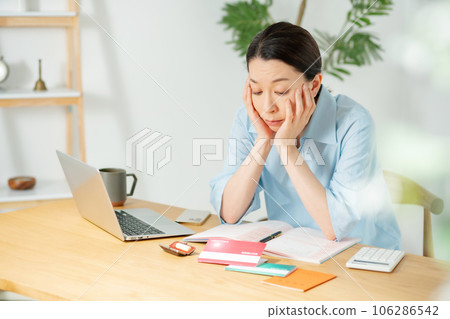 End of life household account book tired woman 106286542