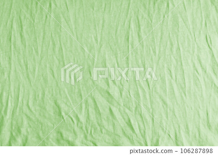 Wrinkled, crumpled bright green jersey fabric texture background Wrinkled, crumpled bright green jersey fabric texture background 106287898
