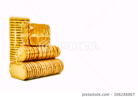 Delicious sweet cookies in a protective cellophane package for sale on a white Delicious sweet cookies in a protective cellophane package for sale on a white 106288867