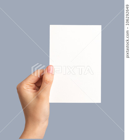 Hand holding greeting holiday card mock up, blank empty postcard Hand holding greeting holiday card mock up, blank empty postcard 106292649
