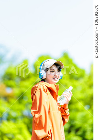 Young woman drinking water 106292670