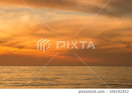 Landscape with a sunset over the Black Sea. Orange burnt flowers sunset. Natural photography of nature 106292852