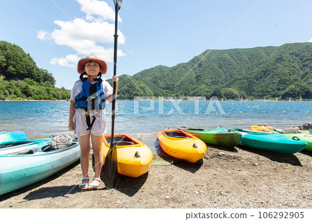 girl enjoying kayaking girl enjoying kayaking 106292905