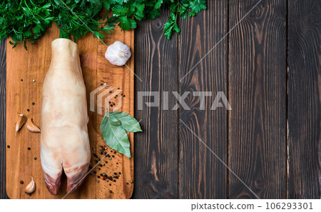 Raw beef hooves for the traditional seasonal dish of khash soup. A dish of boiled cow legs, khash, a dish of the middle east, Turkey and the Caucasus Top view, wooden dark background with copy space 106293301