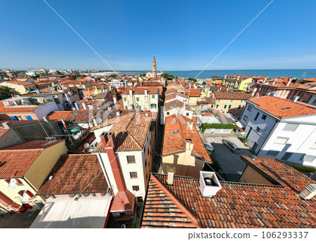 Aerial shot of a Caorle, the Resort sea beach city near to Venice. Red roofs, bright buildings in a day time 106293337