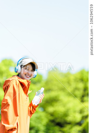 Young woman drinking water 106294559