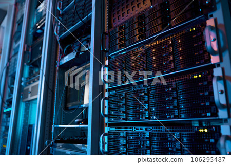 Server rack with supercomputer hardware in big data center inside closeup 106295487