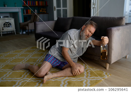 Senior man addicted to alcohol drinking hiding from his wife Senior man addicted to alcohol drinking hiding from his wife 106295641