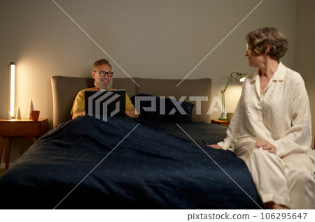 Happy retirement concept, elderly loving couple in bedroom Happy retirement concept, elderly loving couple in bedroom 106295647