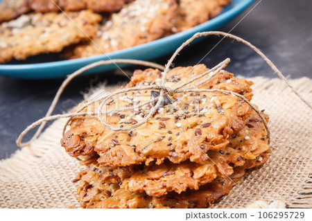 Fresh oatmeal cookies with honey and healthy seeds. Delicious crunchy dessert 106295729
