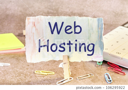 Web Hosting text written on paper next to scattered paper clips, calculator, adhesive paper Web Hosting text written on paper next to scattered paper clips, calculator, adhesive paper 106295922