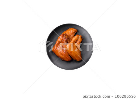 Delicious grilled chicken wings with spices and herbs 106296556