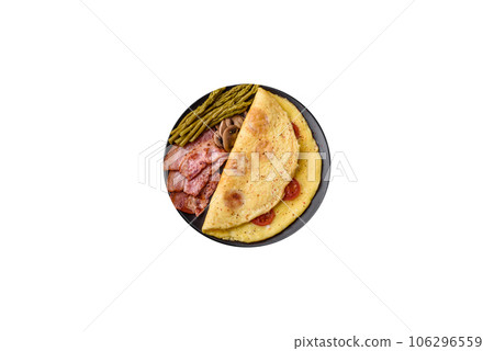 Delicious fresh omelet with cherry tomatoes, bacon, asparagus and spices 106296559