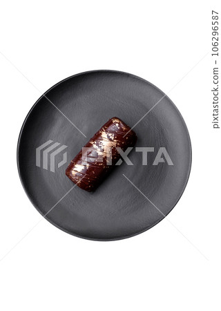 Delicious sweet cheese with syrup covered with chocolate and nuts Delicious sweet cheese with syrup covered with chocolate and nuts 106296587