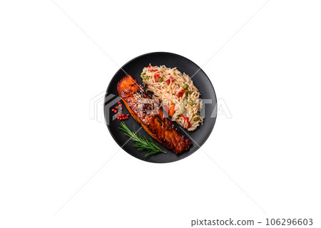 Delicious red salmon fish grilled with sauce and sesame seeds with rice and vegetables Delicious red salmon fish grilled with sauce and sesame seeds with rice and vegetables 106296603