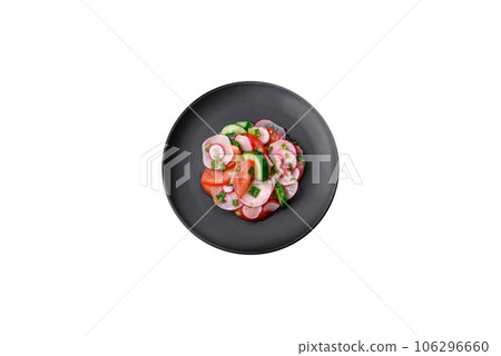 Delicious vegan salad of fresh vegetables of tomatoes, cucumbers and radishes Delicious vegan salad of fresh vegetables of tomatoes, cucumbers and radishes 106296660