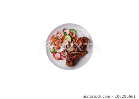 Delicious nutritious dish consisting of grilled chicken legs with a salad 106296661