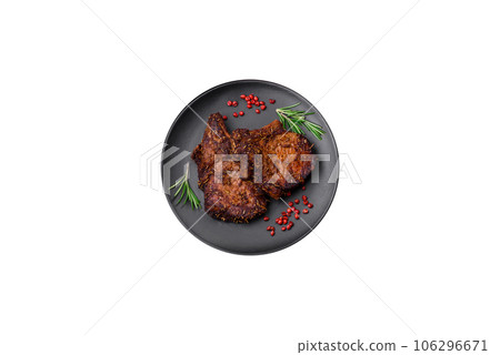 Delicious beef or pork steak on the bone grilled with spices and rosemary 106296671