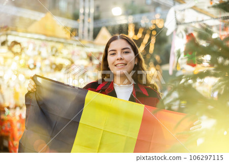 Girl with Belgium flag at new year street fair 106297115