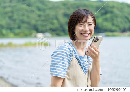 Woman refreshing at the lake Woman traveling Woman traveling Woman going on holiday 106299401