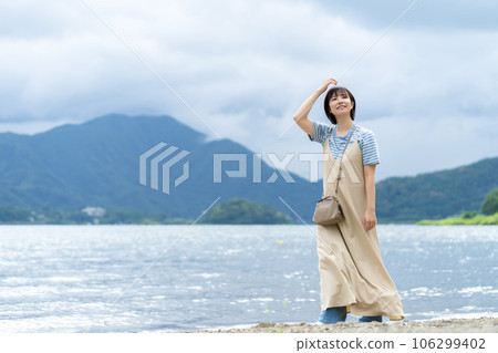 Woman refreshing at the lake Woman traveling Woman traveling Woman going on holiday 106299402