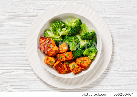 baked salmon bites with steamed broccoli florets baked salmon bites with steamed broccoli florets 106299404