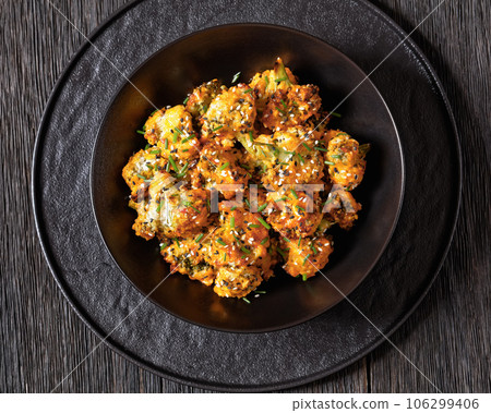 bang bang broccoli bites in bowl, top view 106299406