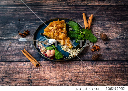 Famous tarte tatin dessert on a plate Famous tarte tatin dessert on a plate 106299962