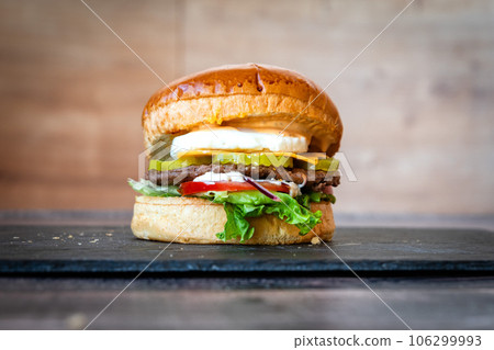 Tasted and fresh traditional hamburger Tasted and fresh traditional hamburger 106299993