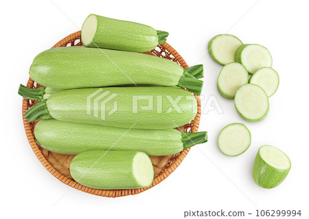 zucchini or marrow in a wicker basket isolated on white background with full depth of field. Top view. Flat lay zucchini or marrow in a wicker basket isolated on white background with full depth of field. Top view. Flat lay 106299994