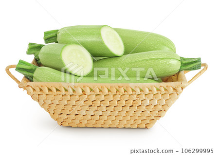 zucchini or marrow in a wicker basket isolated on white background with full depth of field 106299995