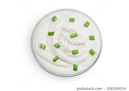 sour cream or yogurt in glass bowl isolated on white background with full depth of field. Top view. Flat lay 106300014