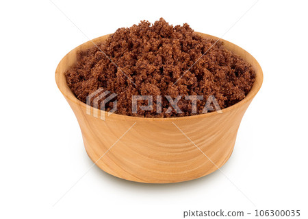 Dark muscovado sugar or Barbados sugar in wooden bowl isolated on white background 106300035