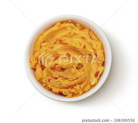Spicy chili pepper butter isolated on white background, top view Spicy chili pepper butter isolated on white background, top view 106300550