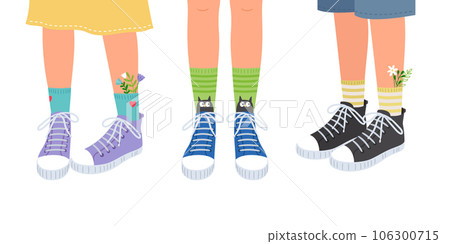 Set of three pairs of childrens feet in sneakers. Beautiful sports shoes, bright high socks with flowers 106300715