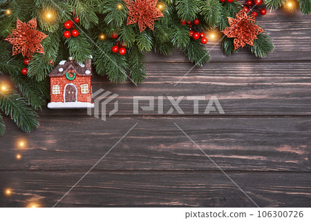Christmas or New Year background with fir branches and decorative house Christmas or New Year background with fir branches and decorative house 106300726