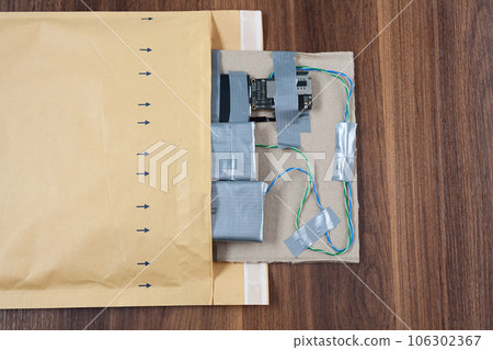 Mail bomb IED - Improvised Explosive Device with c4 and cell phone module in envelope Mail bomb IED - Improvised Explosive Device with c4 and cell phone module in envelope 106302367